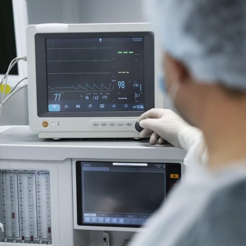 doctor-monitoring-patient-s-pulse